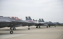 F-35A Lightning IIs from the 34th Fighter Squadron at Hill Air Force Base, Utah, and F-15C Eagles from the 493rd Fighter Squadron, stand by to take-off for a training sortie at Royal Air Force Lakenheath, England, April 20. The F-35A is a fifth generation fighter that provides the joint warfighter unprecedented global precision attack capability against current and emerging threats, while complementing the Air Force’s air superiority fleet. (U.S. Air Force photo/Staff Sgt. Emerson Nuñez)