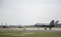F-15C Eagles from the 493rd Fighter Squadron and an F-35A Lightning II from the 34th Fighter Squadron at Hill Air Force Base, taxi to take-off for a training sortie at Royal Air Force Lakenheath, England, April 20. The F-35A is a fifth generation fighter that provides the joint warfighter unprecedented global precision attack capability against current and emerging threats, while complementing the Air Force’s air superiority fleet. (U.S. Air Force photo/Staff Sgt. Emerson Nuñez)