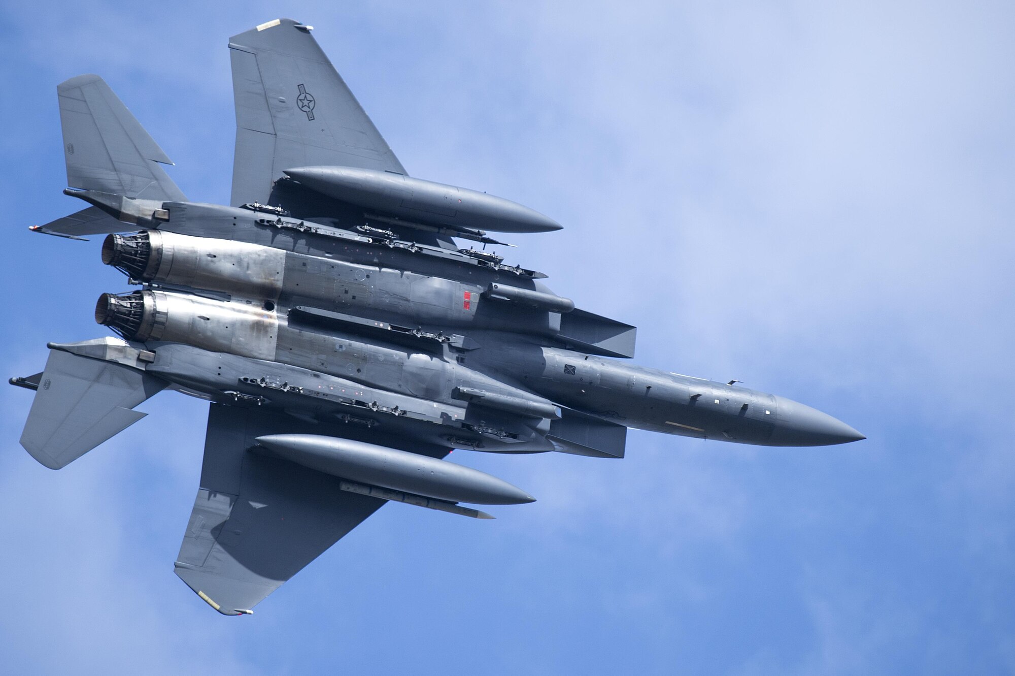 An F-15E Strike Eagle flies over Royal Air Force Lakenheath, England, April 19. Strike Eagles have been assigned to RAF Lakenheath for 25 years. (U.S. Air Force photo/Staff Sgt. Emerson Nuñez)