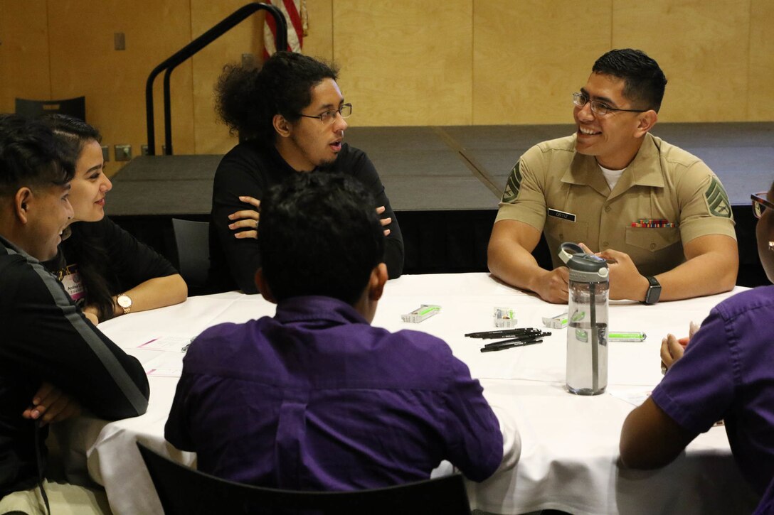 Staff Sergeant Alberto Ortiz, a recruiter with Recruiting Sub-Station Houma, interacts with high school students during the Latinos on the Fast Track Program’s Body, Mind and Spirit Seminar held at Tulane University in New Orleans on April 24, 2017. The seminar comprised of more than 160 high school juniors and seniors from the New Orleans area. (U.S. Marine Corps photo by SSgt. Rubin J. Tan/Released)