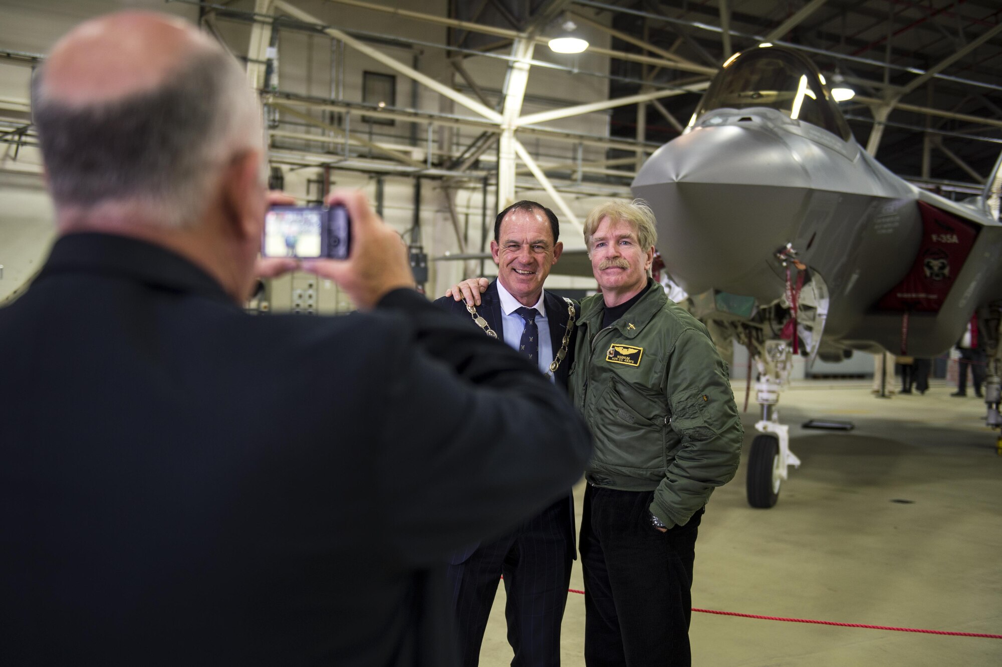 Visitors take photos with an F-35A Lightning II from the 34th Fighter Squadron at Hill Air Force Base, Utah, during a civic leader tour at Royal Air Force Lakenheath, England, April 24, 2017. The fifth generation, multi-role fighter aircraft will be based at RAF Lakenheath and join the 48th Fighter Wing inventory starting in the early 2020s. (U.S. Air Force photo/Senior Airman Malcolm Mayfield)