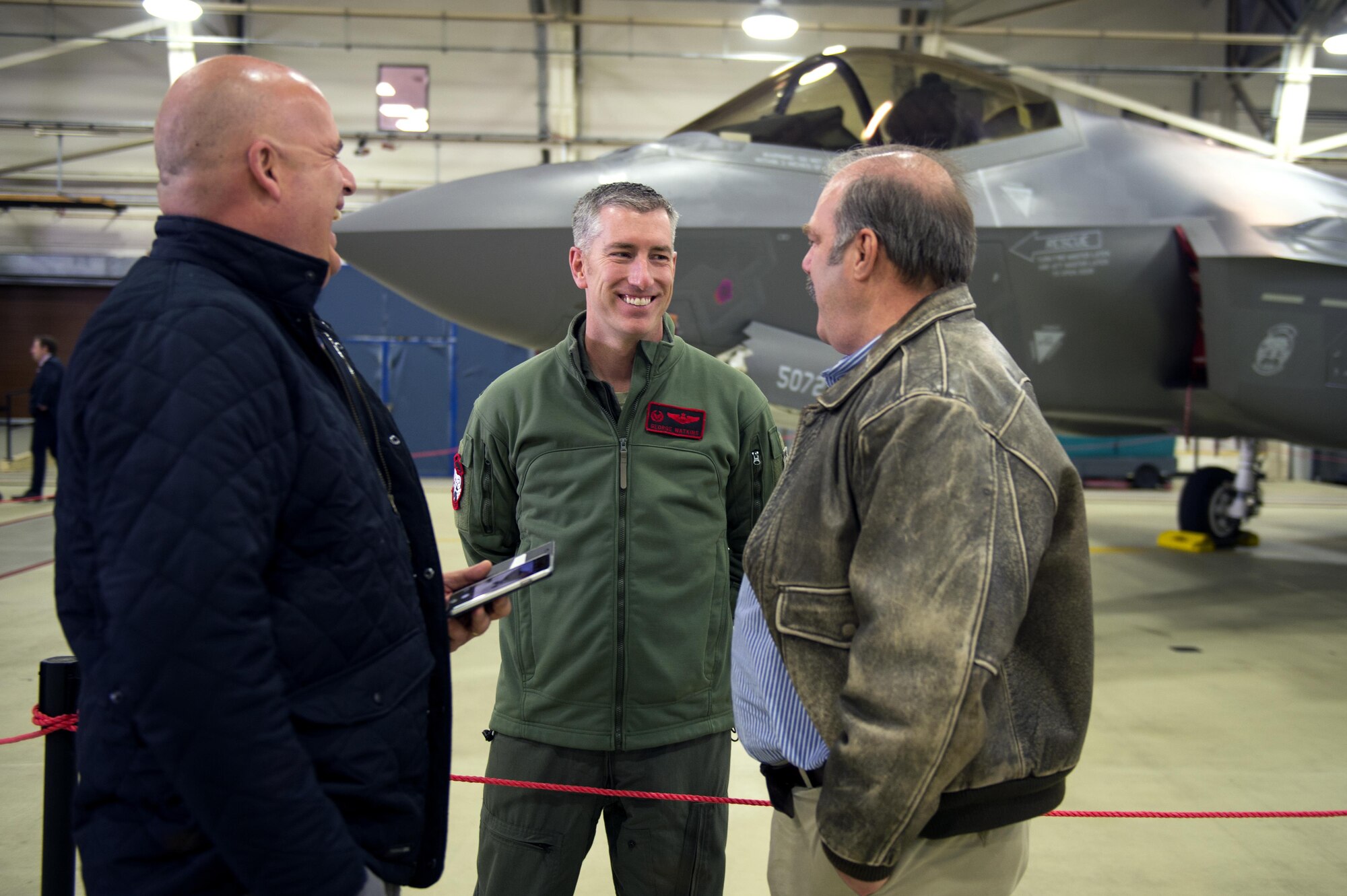 Lt. Col. George Watkins, 34th Fighter Squadron commander at Hill Air Force Base, Utah, speaks with 48th Fighter Wing honorary commanders during a civic leader tour at Royal Air Force Lakenheath, England, April 24, 2017. The event was held to give local community members a close-up look at the F-35A Lightning II’s, which will be based at RAF Lakenheath starting in the early 2020s. (U.S. Air Force photo/Senior Airman Malcolm Mayfield)