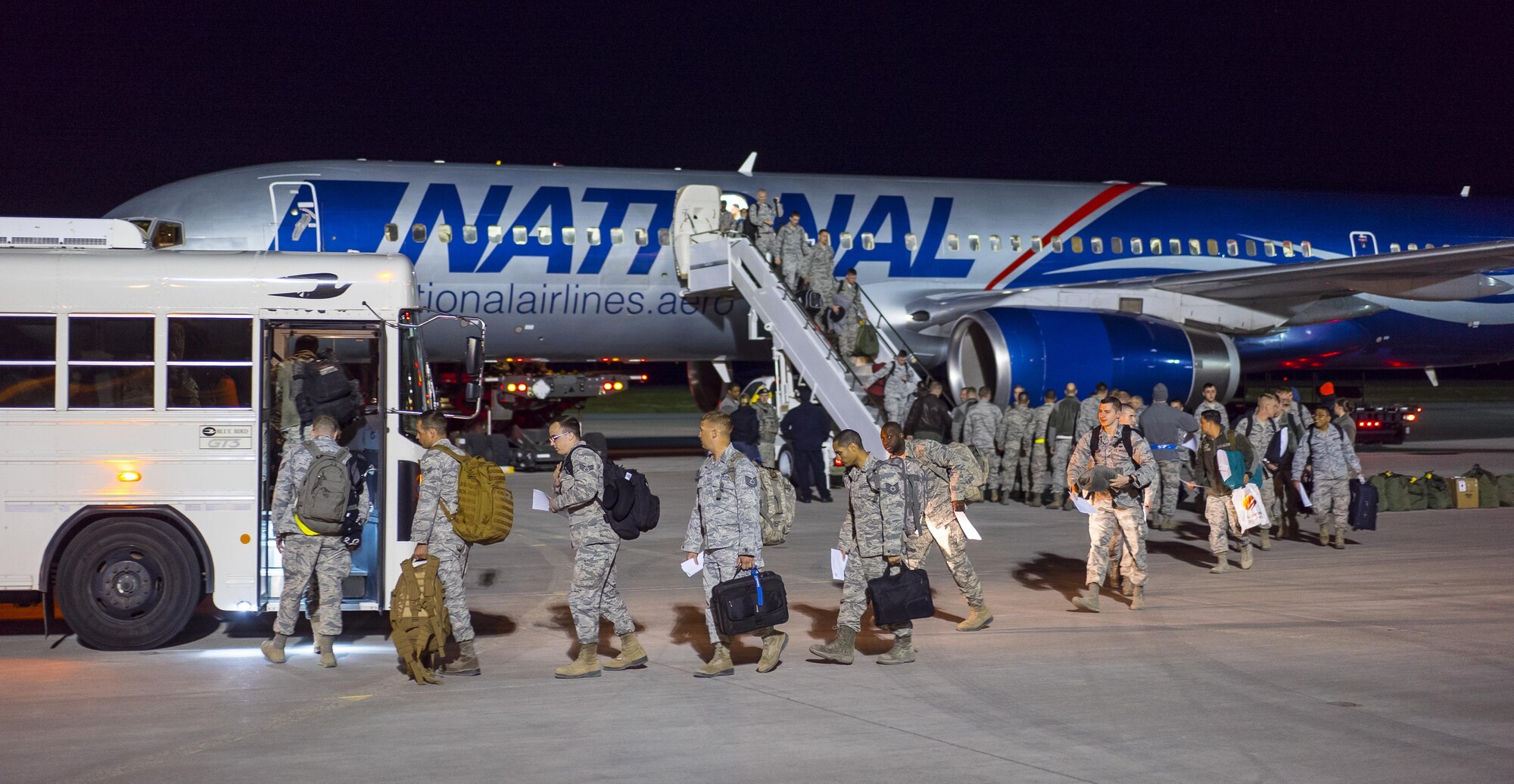 Returning airmen deplane at Mountain Home Air Force Base, Idaho, April 22, 2017. More than 100 airmen assigned to the 726th Air Control Squadron returned from a six-month deployment to locations throughout Southwest Asia. They provided theater command and control for air operations in one of the most complicated airspaces in Air Force history. (U.S. Air Force photo/Staff Sgt. Samuel Morse)