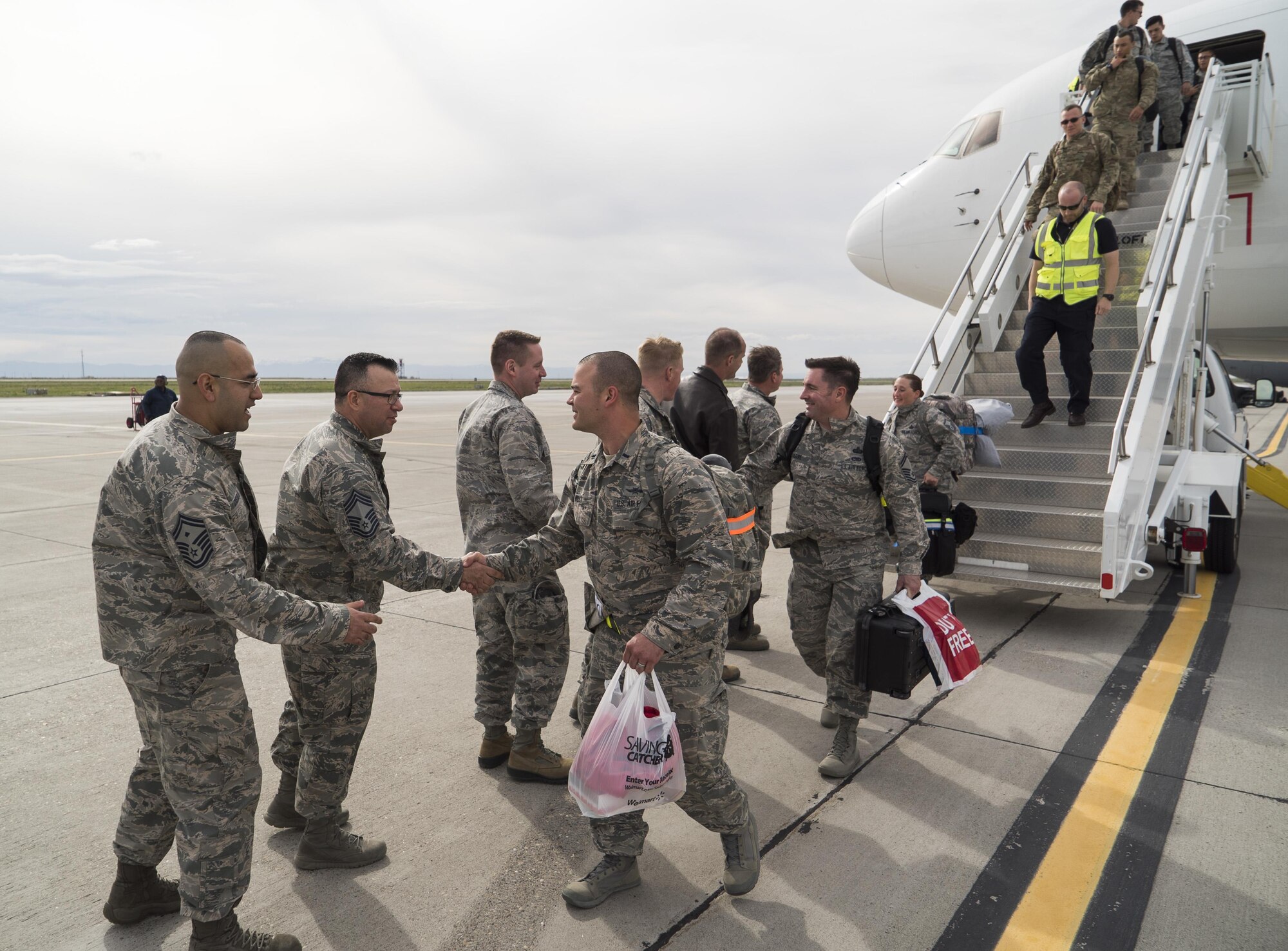 Base leadership welcome home deployers from the 726th Air Control Squadron at Mountain Home Air Force Base, Idaho, April 22, 2017. Despite the two flights being spaced 12 hours apart and challenging weather, the commanders and senior NCOs came out to give the deployers a proper homecoming. (U.S. Air Force photo/Staff Sgt. Samuel Morse)