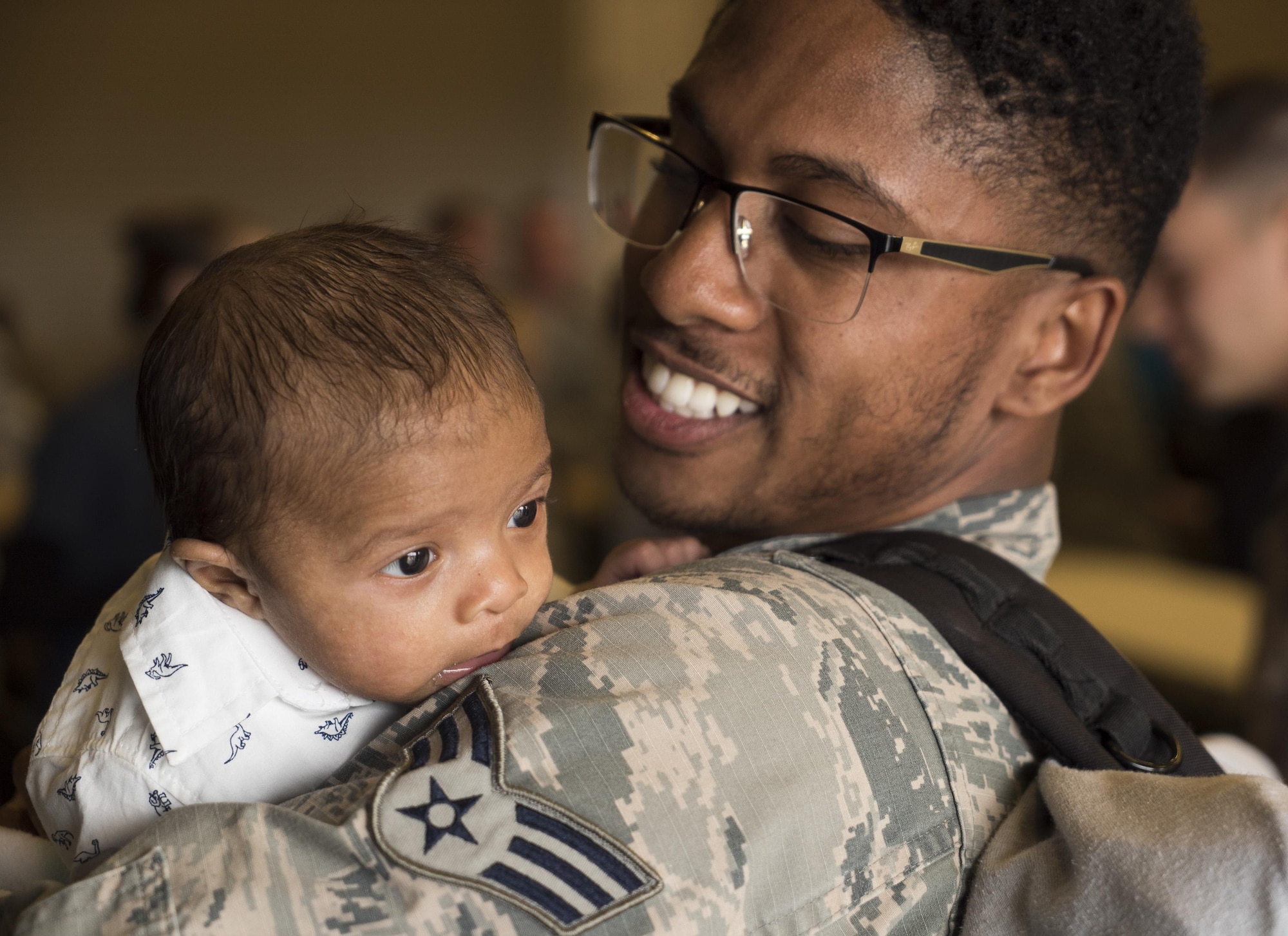 Senior Airman Aaron Wilson, holds his son, Adrian, for the first time at Mountain Home Air Force Base, Idaho, April 22, 2017. Adrian, two months old, was born while Wilson was deployed to Southwest Asia for six months. (U.S. Air Force photo/Staff Sgt. Samuel Morse)