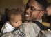 Senior Airman Aaron Wilson, holds his son, Adrian, for the first time at Mountain Home Air Force Base, Idaho, April 22, 2017. Adrian, two months old, was born while Wilson was deployed to Southwest Asia for six months. (U.S. Air Force photo/Staff Sgt. Samuel Morse)