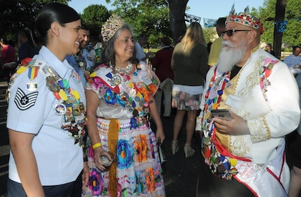 El Rey de Barrio King Steve Duran (right) chats with Queen Virginia Duran (center) and Joint Base San Antonio Air Force Ambassador Tech. Sgt. Marie Sarabia (left) during a reception at JBSA-Fort Sam Houston April 23.