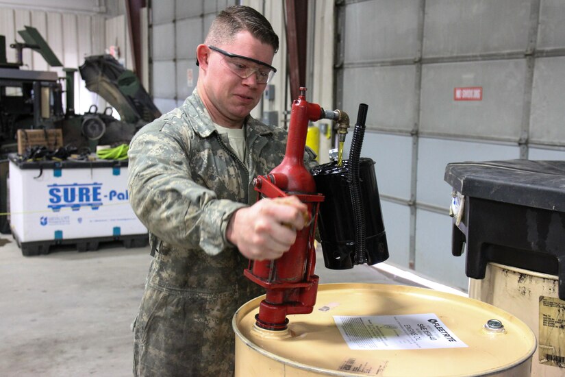 U.S. Army Reserve Cpl. Tyler Snyder, mechanic, fills a container with oil to fill a vehicle during Operation Cold Steel at Fort McCoy, Wis., April 13, 2017. Operation Cold Steel is the U.S. Army Reserve's crew-served weapons qualification and validation exercise to ensure that America's Army Reserve units and Soldiers are trained and ready to deploy on short-notice and bring combat-ready and lethal firepower in support of the Army and our joint partners anywhere in the world. (U.S. Army Reserve photo by Staff Sgt. Debralee Best, 84th Training Command)