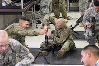 U.S. Army Reserve Sgt. Virginia Creed (right) and Pfc. Ethan Vidrine, 490th Civil Affairs Battalion, U.S. Army Civil Affair and Psychological Operations Command, assemble an M240B machine gun while completing primary marksmanship instruction  during Operation Cold Steel at Fort McCoy, Wis., April 20, 2017. Operation Cold Steel is the U.S. Army Reserve's crew-served weapons qualification and validation exercise to ensure that America's Army Reserve units and Soldiers are trained and ready to deploy on short-notice and bring combat-ready and lethal firepower in support of the Army and our joint partners anywhere in the world. (U.S. Army Reserve photo by Staff Sgt. Debralee Best, 84th Training Command)