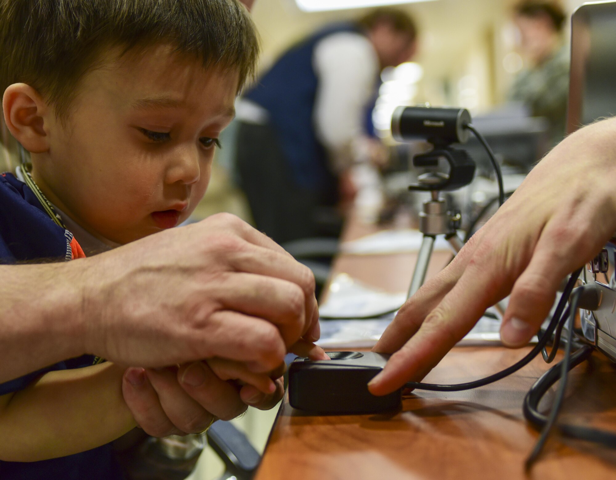 Paul Romehildt has his fingerprint scanned during the 2017 Children’s Fair inside the 28th Medical Group at Ellsworth Air Force Base, S.D., April 20, 2017. Volunteer organizations created a child-identification kit for parents using collected fingerprints, pictures and DNA. (U.S. Air Force photo by Airman 1st Class Randahl J. Jenson)