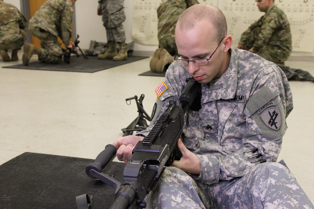 U.S. Army Reserve Sgt. Bryan Collins, 490th Civil Affairs Battalion, U.S. Army Civil Affair and Psychological Operations Command, preforms a function check after reassembling an M240B machine gun during Operation Cold Steel at Fort McCoy, Wis., April 20, 2017. Operation Cold Steel is the U.S. Army Reserve's crew-served weapons qualification and validation exercise to ensure that America's Army Reserve units and Soldiers are trained and ready to deploy on short-notice and bring combat-ready and lethal firepower in support of the Army and our joint partners anywhere in the world. (U.S. Army Reserve photo by Staff Sgt. Debralee Best, 84th Training Command)
