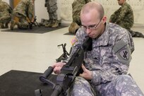 U.S. Army Reserve Sgt. Bryan Collins, 490th Civil Affairs Battalion, U.S. Army Civil Affair and Psychological Operations Command, preforms a function check after reassembling an M240B machine gun during Operation Cold Steel at Fort McCoy, Wis., April 20, 2017. Operation Cold Steel is the U.S. Army Reserve's crew-served weapons qualification and validation exercise to ensure that America's Army Reserve units and Soldiers are trained and ready to deploy on short-notice and bring combat-ready and lethal firepower in support of the Army and our joint partners anywhere in the world. (U.S. Army Reserve photo by Staff Sgt. Debralee Best, 84th Training Command)