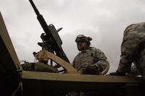 U.S. Army Reserve Spc. Zachary Rumo, 366th Engineer Company, 412th Theater Engineer Command, steadies an M2 .50 caliber machine gun after completing basic live fire during Operation Cold Steel at Fort McCoy, Wis., April 20, 2017. Operation Cold Steel is the U.S. Army Reserve's crew-served weapons qualification and validation exercise to ensure that America's Army Reserve units and Soldiers are trained and ready to deploy on short-notice and bring combat-ready and lethal firepower in support of the Army and our joint partners anywhere in the world. (U.S. Army Reserve photo by Staff Sgt. Debralee Best, 84th Training Command)