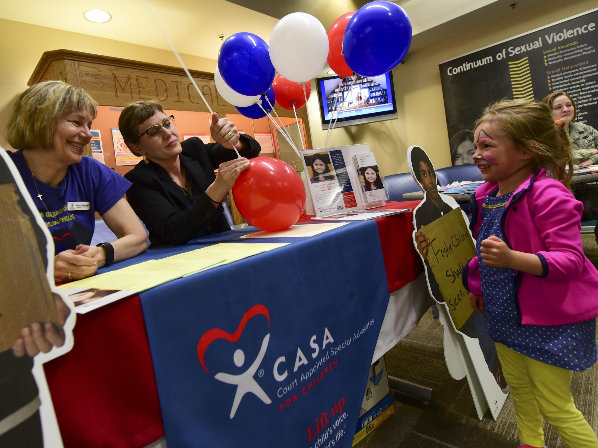 Aniah Perry waits for a balloon during the 2017 Children’s Fair inside the 28th Medical Group at Ellsworth Air Force Base, S.D., April 20, 2017. Volunteer and non-profit organizations such as Youth and Family Services, Court Appointed Special Advocates, Family Advocacy and the Children’s Home Society participated in the event, providing parents with resources and information on child abuse prevention. (U.S. Air Force photo by Airman 1st Class Randahl J. Jenson)  