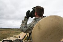 U.S. Army Reserve Spc. Zachary Rumo, 366th Engineer Company, 412th Theater Engineer Command, dons his protective mask while competing the basic live-fire course during Operation Cold Steel at Fort McCoy, Wis., April 20, 2017. Operation Cold Steel is the U.S. Army Reserve's crew-served weapons qualification and validation exercise to ensure that America's Army Reserve units and Soldiers are trained and ready to deploy on short-notice and bring combat-ready and lethal firepower in support of the Army and our joint partners anywhere in the world. (U.S. Army Reserve photo by Staff Sgt. Debralee Best, 84th Training Command)