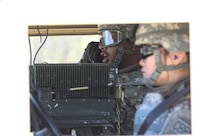 U.S. Army Reserve Sgt. Terrance Rodgers (far), speaks on the radio, while Pfc. Shasha Wang, waits for his command to begin the blank-fire range during Operation Cold Steel at Fort McCoy, Wis., April 22, 2017. Both Soldiers are with the 419th Combat Sustainment Support Battalion, 79th Sustainment Support Command. Operation Cold Steel is the U.S. Army Reserve's crew-served weapons qualification and validation exercise to ensure that America's Army Reserve units and Soldiers are trained and ready to deploy on short-notice and bring combat-ready and lethal firepower in support of the Army and our joint partners anywhere in the world. (U.S. Army Reserve photo by Staff Sgt. Debralee Best, 84th Training Command)