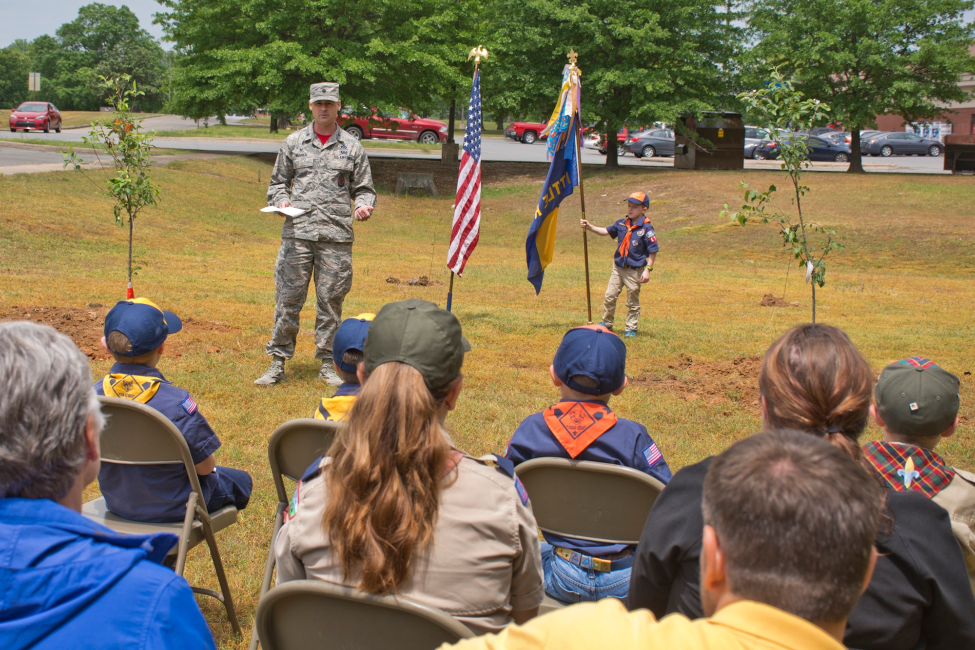 U.S. Air Force Lt. Col. Daniel Werner, commander, 19th Civil Engineer Squadron, speaks during the dedication ceremony of two fruit trees April 21, 2017, at Little Rock Air Force Base, Ark. Members of Cub Scout Pack 170, which is located on base, planted the trees to attract pollinators such as bees, wasps, hummingbirds and butterflies in honor of Earth Day 2017. (U.S. Air Force photo by Master Sgt. Jeff Walston/Released)