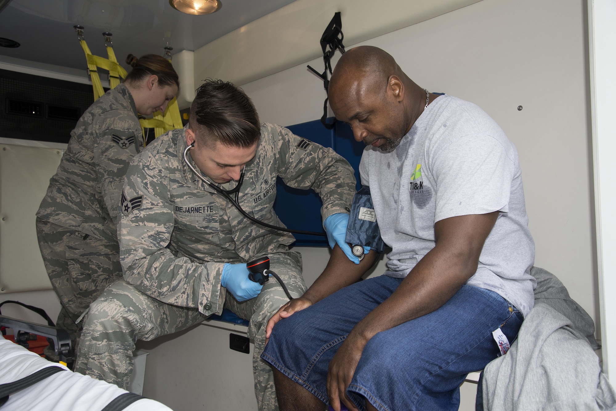 Senior Airman David Dejarnette, 436th Medical Operations Squadron medic, takes the blood pressure of Patrick Shaffer, 436th Logistics Readiness Squadron Petroleum, Oil and Lubricants fuel systems operator, during a fuel spill exercise April 20, 2017, at Dover Air Force Base, Del. During the simulation, Shaffer feigned full-body Jet-A fuel exposure to evaluate Team Dover’s emergency response capabilities. (U.S. Air Force photo by Senior Airman Aaron J. Jenne)