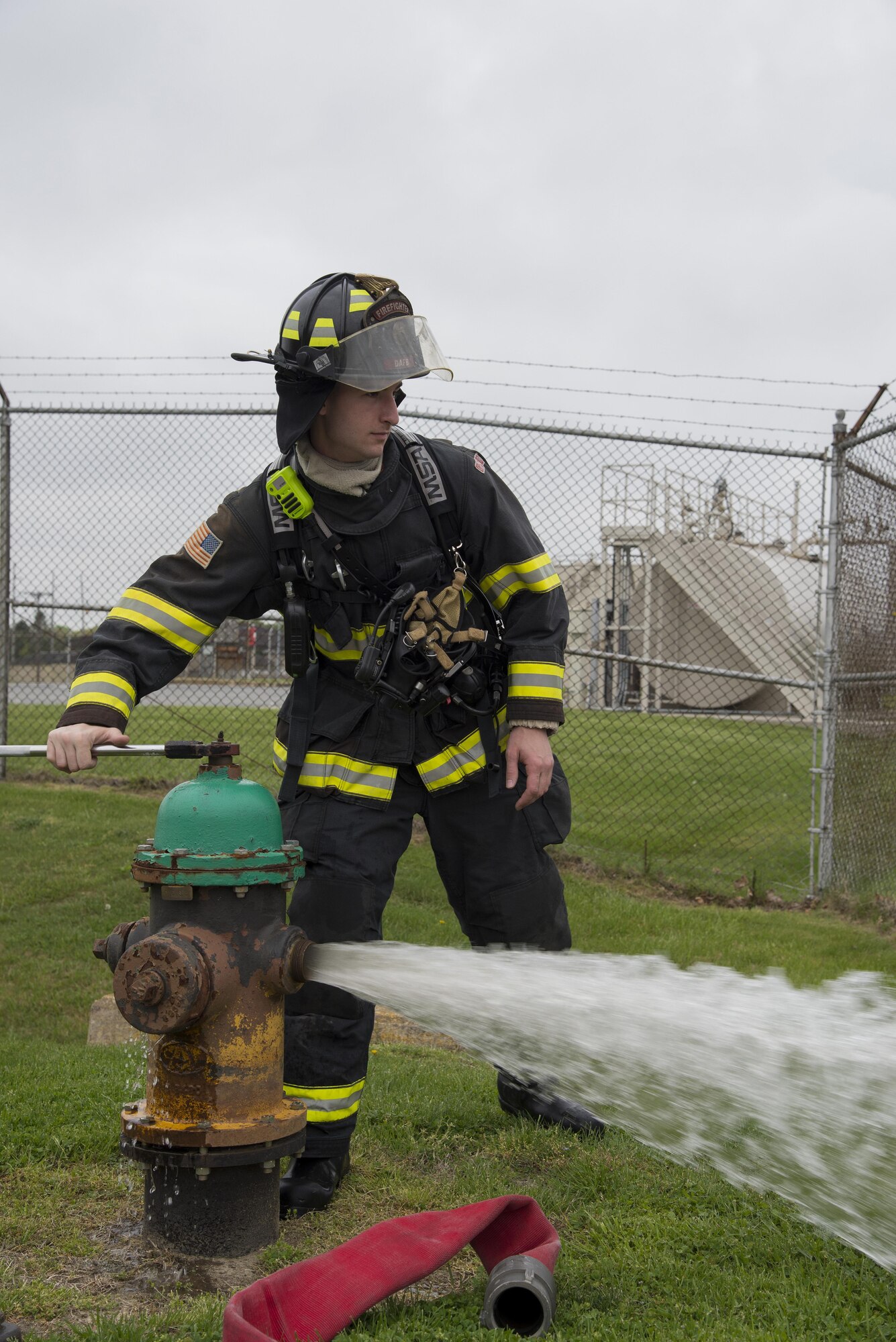 Senior Airman Seth Bollmann, 436th Civil Engineer Squadron Fire Department driver operator, opens a hydrant prior to filling a firetruck’s onboard water reservoir during a fuel spill exercise April 20, 2017, at Dover Air Force Base, Del. Members of the fire department demonstrated equipment functionality and knowledge at the direction of the Wing Inspection Team evaluators. (U.S. Air Force photo by Senior Airman Aaron J. Jenne)