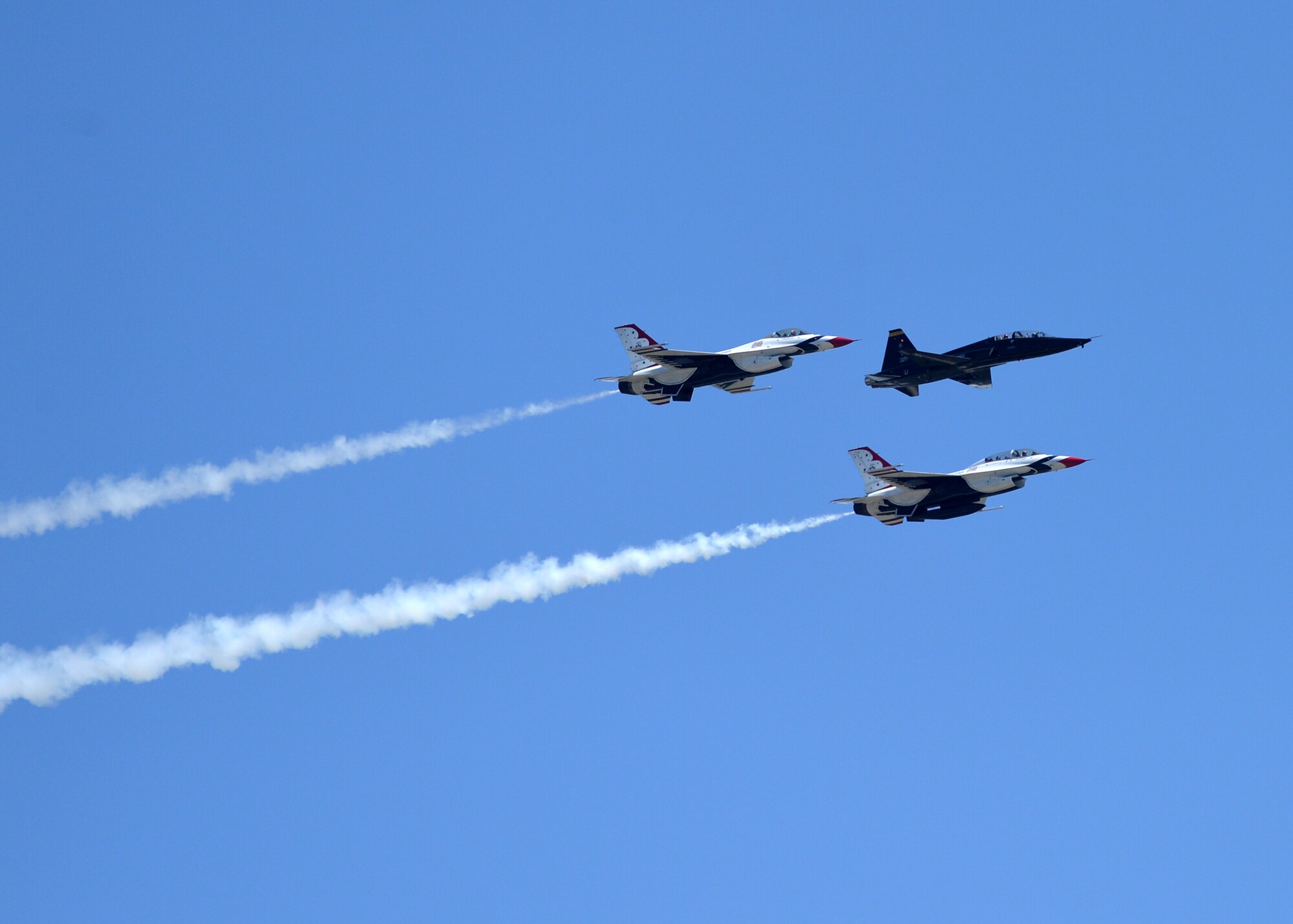 Retired U.S. Air Force Lt. Col. Dale Cooke, former 1982 Thunderbirds slot pilot and Lt. Col. Richard McCurdy, 2nd Fighter Training Squadron commander (middle position), are accompanied by U.S. Air Force Air Demonstration Squadron Thunderbirds Maj. Nick Krajicek, slot pilot (left), and Lt. Col. Kevin Walsh, operations officer (bottom right), during a low pass over the flight line at Tyndall Air Force Base, Fla., April 21, 2017. Cooke flew aircraft #177 (Slot Machine) in the early 1980s and the name Slot Machine was carried over to the current F-16 Falcon that holds the slot position in the Thunderbirds formation. (U.S. Air Force photo by Tech. Sgt. Javier Cruz/ Released)