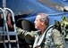 Retired U.S. Air Force Lt. Col. Dale Cooke, former Thunderbirds slot position pilot, places a hand on the airframe of the same aircraft (Slot Machine) he flew 35 years ago after completing an historic flight with the current Thunderbirds slot position No.4 jet at Tyndall Air Force Base, Fla., April 21, 2017. Cooke and Slot Machine inspired generations of Americans across 200 performances around the country in the early 1980s. (U.S. Air Force photo by Tech. Sgt. Javier Cruz/ Released)