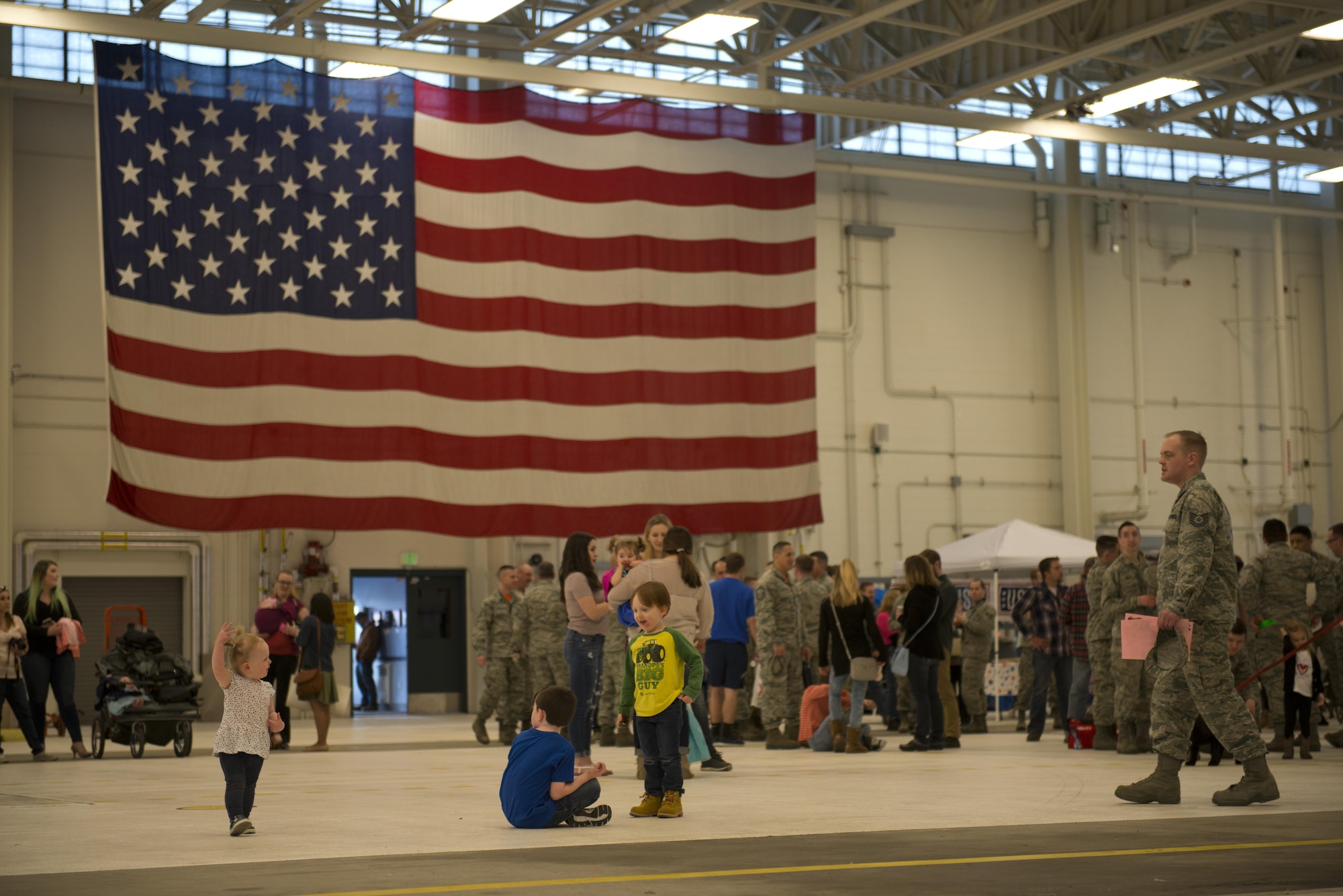Friends and Families wait at Hangar 25 on Joint Base Elmendorf-Richardson, Alaska April 21 for the 525th Fighter Squadron to return from a 7-month deployment. For many families, this was their first time being separated from their loved ones for an extended period of time. 