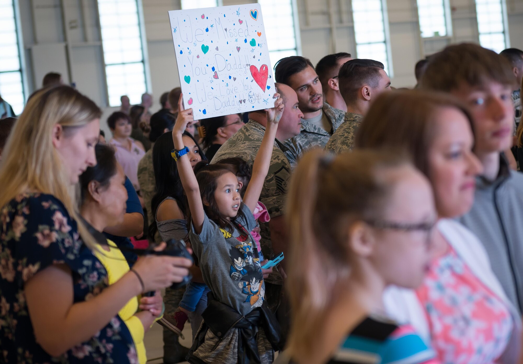 Friends and Families wait at Hangar 25 on Joint Base Elmendorf-Richardson, Alaska April 21 for the 525th Fighter Squadron to return from a 7-month deployment. For many families, this was their first time being separated from their loved ones for an extended period of time.
