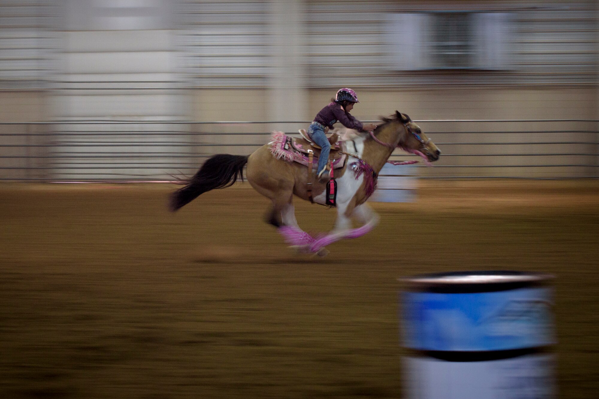 Savannah, daughter of Lt. Col. Nicole Roberts, 21st Security Forces Squadron commander, sprints the last stretch of her run at a barrel racing event in Loveland, Colo., April 15, 2017. Savannah inherited her love of horses from her parents. (U.S. Air Force photo by Airman 1st Class Dennis Hoffman)