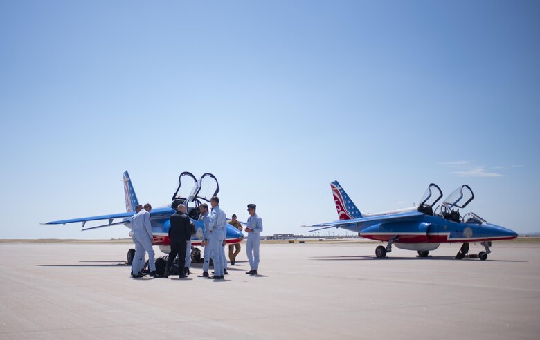 PETERSON AIR FORCE BASE, Colo. – French pilots with the Patrouille de France arrive at Peterson Air Force Base, Colo., to refuel after a flyover demonstration for the U.S. Air Force Academy, April 19, 2017. One of the pilots, French Maj. Nicolas Lieumont, was a former exchange student at the U.S. Air Force Academy.  (U.S. Air Force photo by Airman 1st Class Dennis Hoffman)