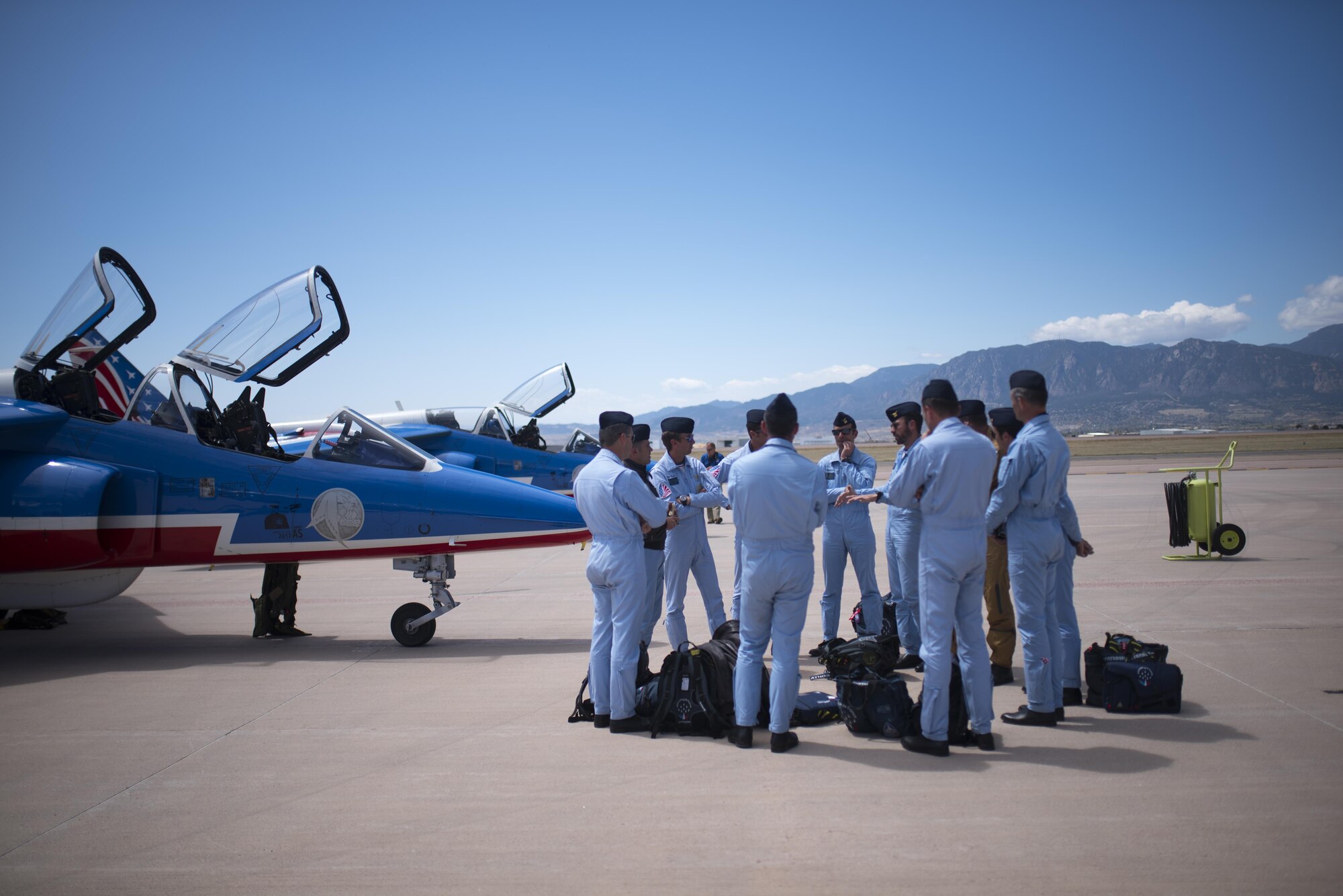 PETERSON AIR FORCE BASE, Colo. – French pilots with the Patrouille de France arrive at Peterson Air Force Base, Colo., to refuel after a flyover demonstration for the U.S. Air Force Academy, April 19, 2017. One of the pilots, French Maj. Nicolas Lieumont, was a former exchange student at the U.S. Air Force Academy.  (U.S. Air Force photo by Airman 1st Class Dennis Hoffman)