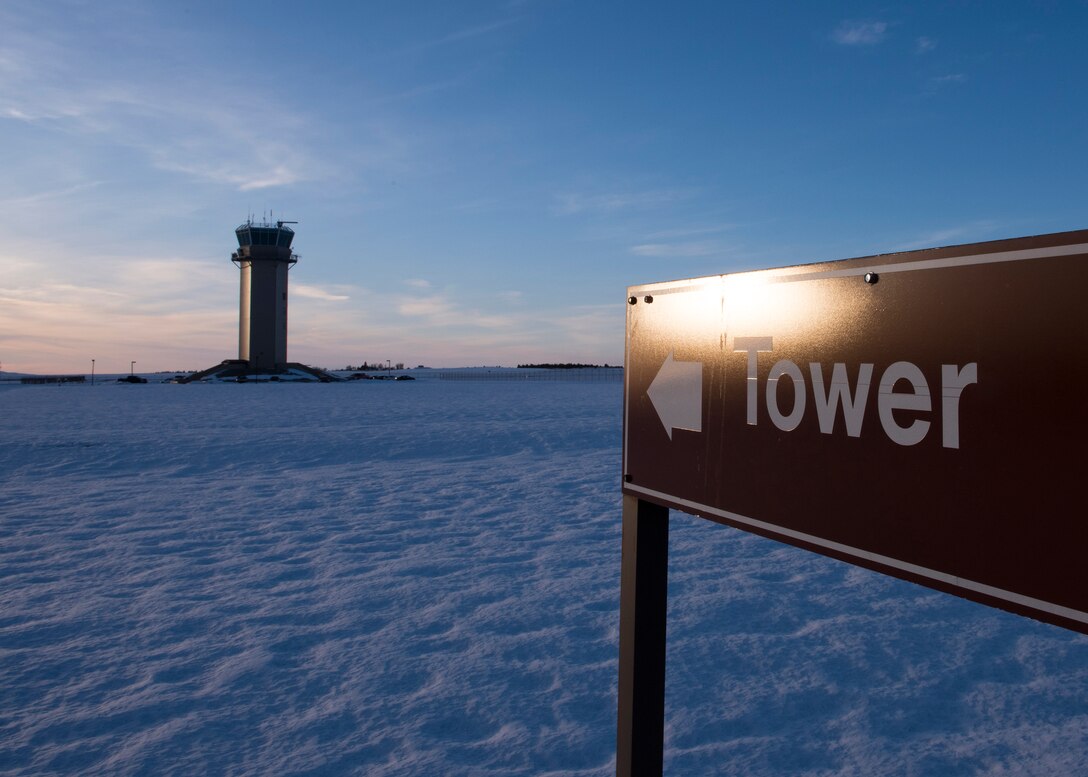 The base air traffic contol tower stands above the flightline Feb. 8, 2017 at Fairchild Air Force Base, Washington. The tower is positioned to give a complete view of the airfield and to give an unobstructed view of all incoming flights. (U.S. Air photo/Airman 1st Class Ryan Lackey)