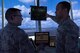 A trainer and trainee interact during a lesson of radar monitoring at the Air Traffic Control Tower Apr. 18, 2017, Fairchild Air Force Base, Washington. All ATC Airmen are trained in tower and radar operations, yet require up to a year of additional on the job experience before they can man a station solo. (U.S. Air Force photo/Airman 1st Class Ryan Lackey)