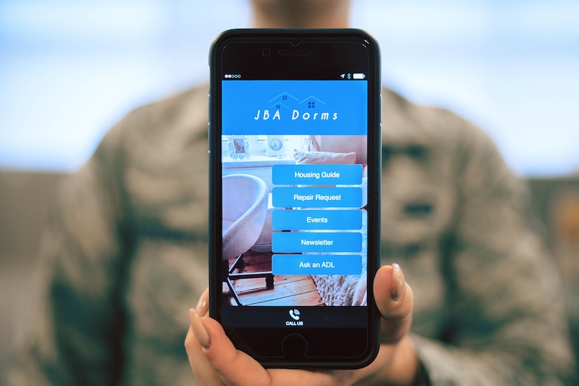 The Joint Base Andrews Dorm Mobile Application is displayed on a phone at JBA, Md., April 25, 2017. The app, which is free and currently available for download from either the Apple App Store or the Google Play Store, provides up-to-date dorm event calendar, the unaccompanied housing guide, a newsletter and an option for repair request. (U.S. Air Force photo by Senior Airman Delano Scott)