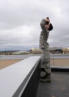 Airman Connor McDonald, 5th Operations Support Squadron weather forecaster, measures the basis of clouds with a rangefinder at Minot Air Force Base, N.D., April 18, 2017. The rangefinder uses a pinpoint laser to measure the distance from the clouds to the ground. (U.S. Air Force photos/Airman 1st Class Dillon Audit)