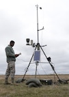 Airman 1st Class Errol Petgrave, 5th Operations Support Squadron weather forecaster, inspects the Deployed Tactical Meteorological Observing System for damage at Minot Air Force Base, N.D., April 18, 2017. Petgrave is checking the statistics and the raw data from the TMQ-53, which afterwards sends the data to their computer. (U.S. Air Force photos/Airman 1st Class Dillon Audit)