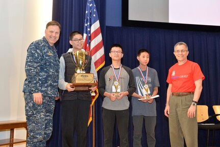 Naval Surface Warfare Center, Carderock Division Commanding Officer Capt. Mark Vandroff (left) and Carderock Division Technical Director Dr. Tim Arcano (right) pose with Sean Power from Chesapeake Math Program in Columbia, Md.; Joshua Fu from Basis Independent McLean in McLean, Va; and Fang Du from Roberto Clemente Middle School in Germantown, Md., who placed first, second and third, respectively, in the Carderock Math Contest, in West Bethesda, Md., March 24, 2017. (U.S. Navy photo by Devin Pisner/Released)