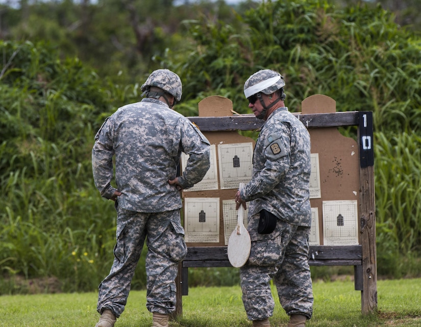 CAMP SWIFT, Texas – US Army Reserve Sgt. 1st Class Francis Jaeger (right), an operations noncommissioned officer with Headquarters and Headquarters Company, 980th Engineer Battalion, Austin, and Fort Worth, Texas native, coaches a reserve Soldier on basic rifle marksmanship techniques, such as breathing and sight picture, while reviewing his target during a rifle range conducted here, April 22, 2017. (US Army Reserve photo by Sgt. Quentin Johnson, 211th MPAD/Released)