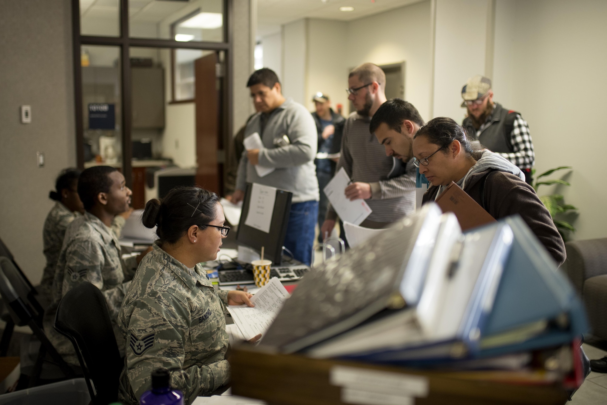 PETERSON AIR FORCE BASE, Colo. –Individual Ready Reserve Muster attendees gather in the lobby of the Summit Center to begin processing through required stations here at Peterson Air Force Base, Colo., April 22, 2017. In case U.S. Congress declares a state of national emergency or declares war, individuals with years left on their service requirement can be activated at any time. (U.S. Air Force photo by Airman 1st Class Dennis Hoffman)