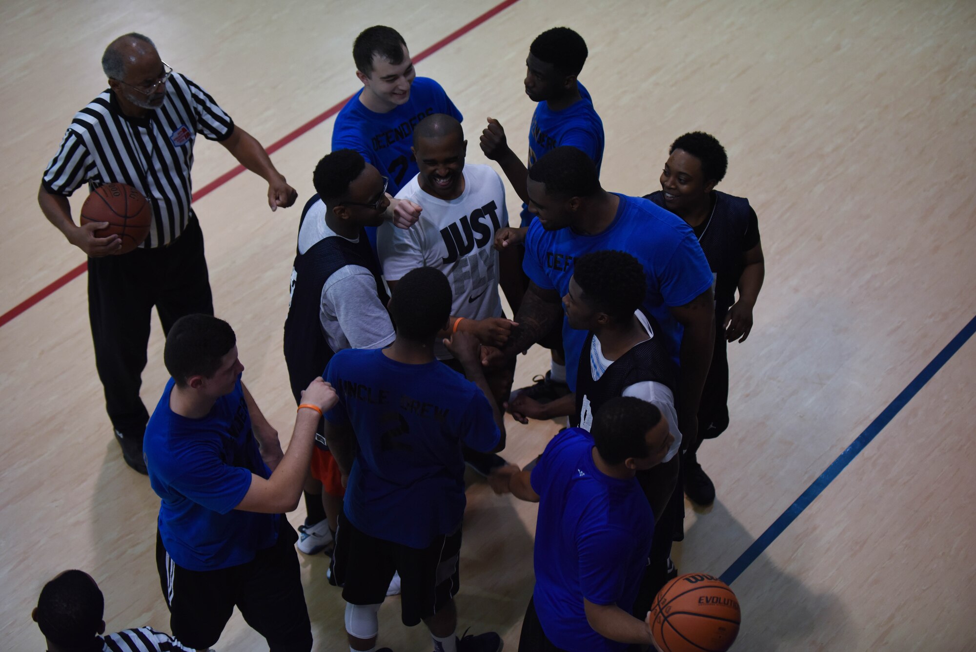 The 2nd Security Forces Squadron basketball team huddles up before the start of the second game in the Intramural Basketball Championship at Barksdale Air Force Base, La., April 18, 2017. The 2nd Force Support Squadron basketball team needed to beat the 2nd SFS team to win the championship. (Air Force photo/Airman 1st Class Stuart Bright)