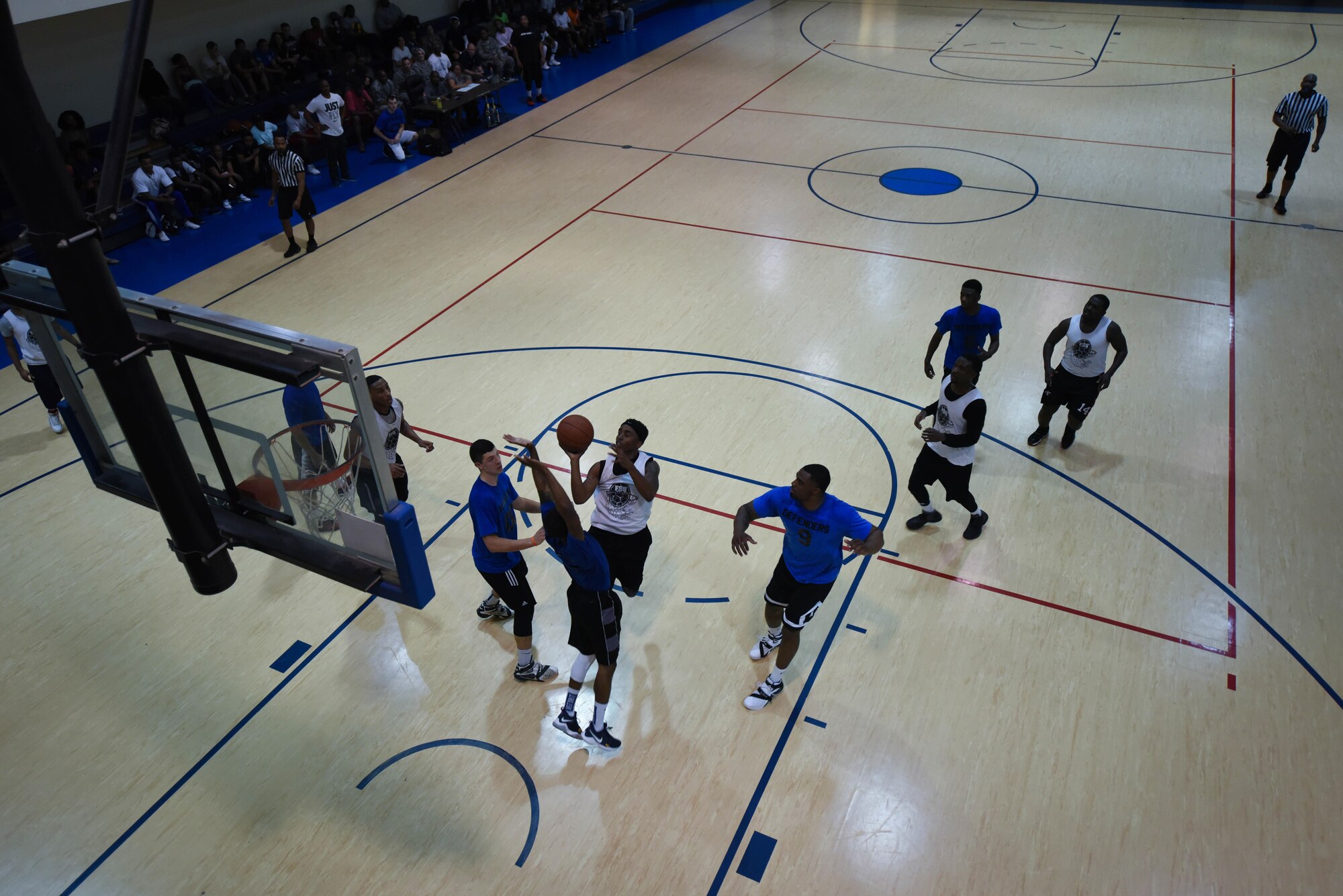The 2nd Force Support Squadron and 2nd Security Forces Squadron basketball teams play game two of the Intramural Basketball Championship at Barksdale Air Force Base, La., April 18, 2017. In a double elimination tournament, the second game was winner take all. (Air Force photo/Airman 1st Class Stuart Bright)