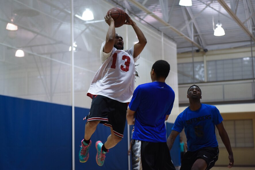 Sephos McCullough, 2nd Force Support Squadron guard, leaps to make a clear shot at Barksdale Air Force Base, La., April 18, 2017. McCullough scored seven points in the first game and six points in the second game. (Air Force photo/Airman 1st Class Stuart Bright)