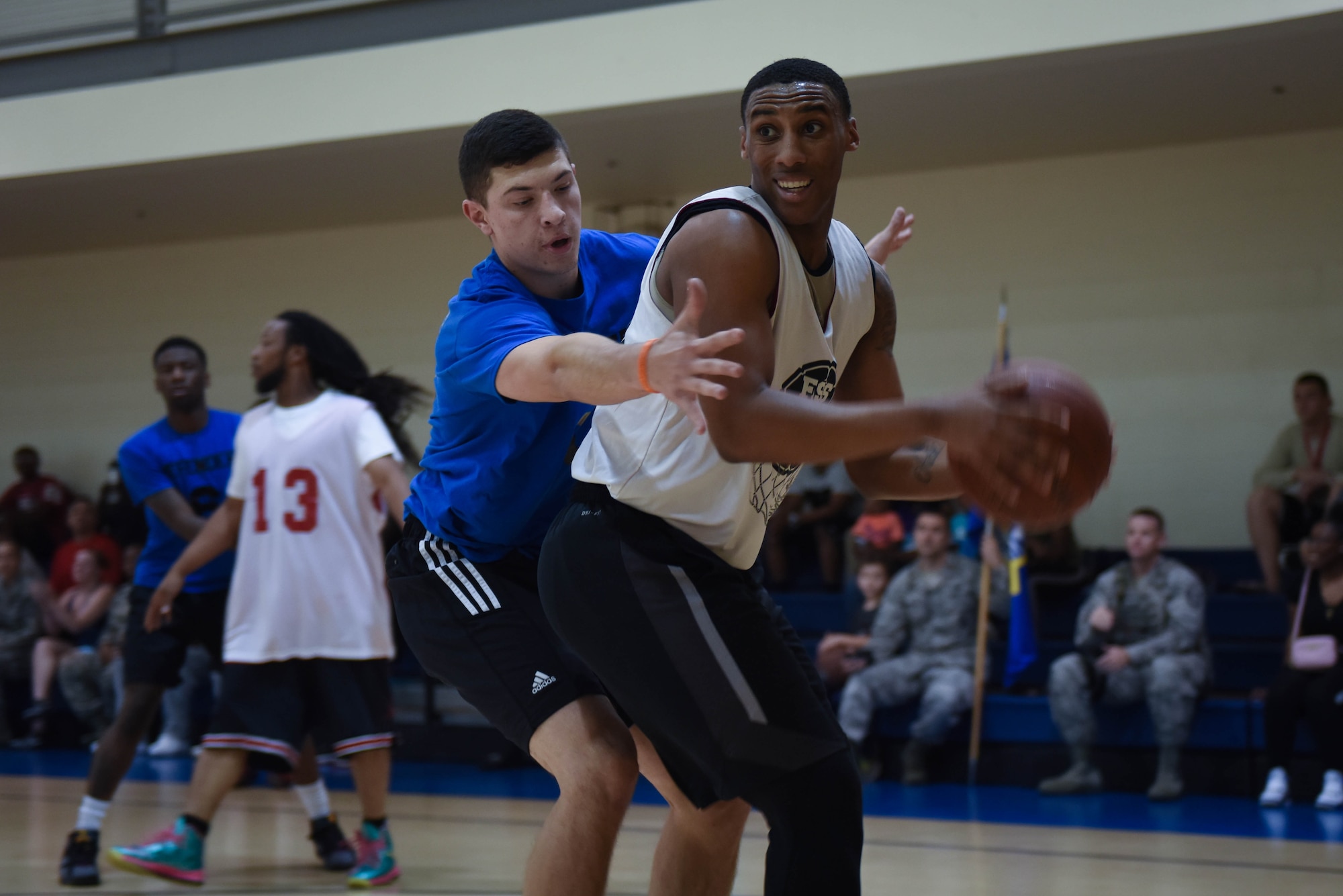 Hunter Benham, 2nd Force Support Squadron forward, attempts to shake a 2nd Security Forces Squadron defender in the first game of the Intramural Basketball Championship at Barksdale Air Force Base, La., April 18, 2017. Benham scored the most in game one with 27 points. (Air Force photo/Airman 1st Class Stuart Bright)