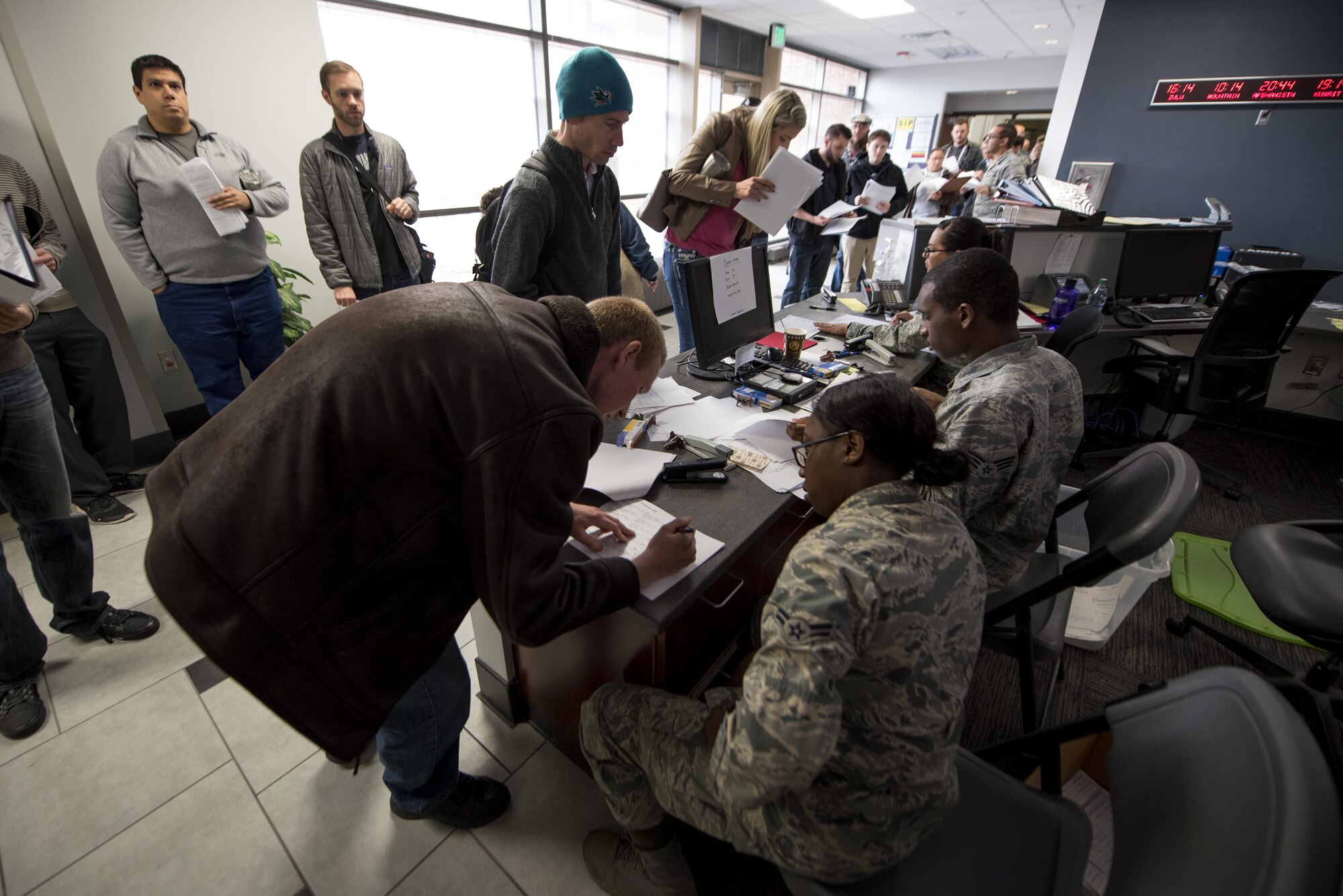 PETERSON AIR FORCE BASE, Colo. –Individual Ready Reserve Muster attendees gather in the lobby of the Summit Center to begin processing through required stations here at Peterson Air Force Base, Colo., April 22, 2017. The muster brought in more than 100 Individual Ready Reservists currently residing within 150-miles of Peterson AFB. (U.S. Air Force photo by Airman 1st Class Dennis Hoffman)