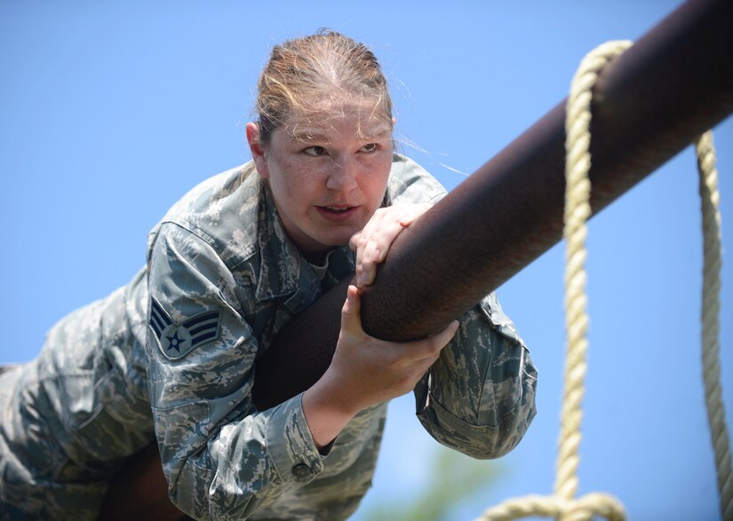 U.S. Air Force Senior Airman Ashley King, 633rd Civil Engineer Squadron pest management technician, crawls along a pipe during a Prime Base Engineer Emergency Force training at Joint Base Langley-Eustis, Va., April 20, 2017. The five teams that participated in the training had to assess the best way to accomplish the course, which involved each member having to cross a moat within a specific amount of time. (U.S. Air Force photo/Airman 1st Class Kaylee Dubois)