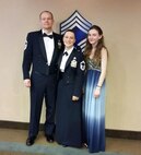 SCHRIEVER AIR FORCE BASE, Colo.--  Erin Ford (right) stands with her parents, Chief Master Sgts. Christopher and Patricia Ford, following a ceremony in 2016. April is designated the month of the Military Child to highlight the daily sacrifices they make while their loved ones are serving. (Photo courtesy the Ford family)