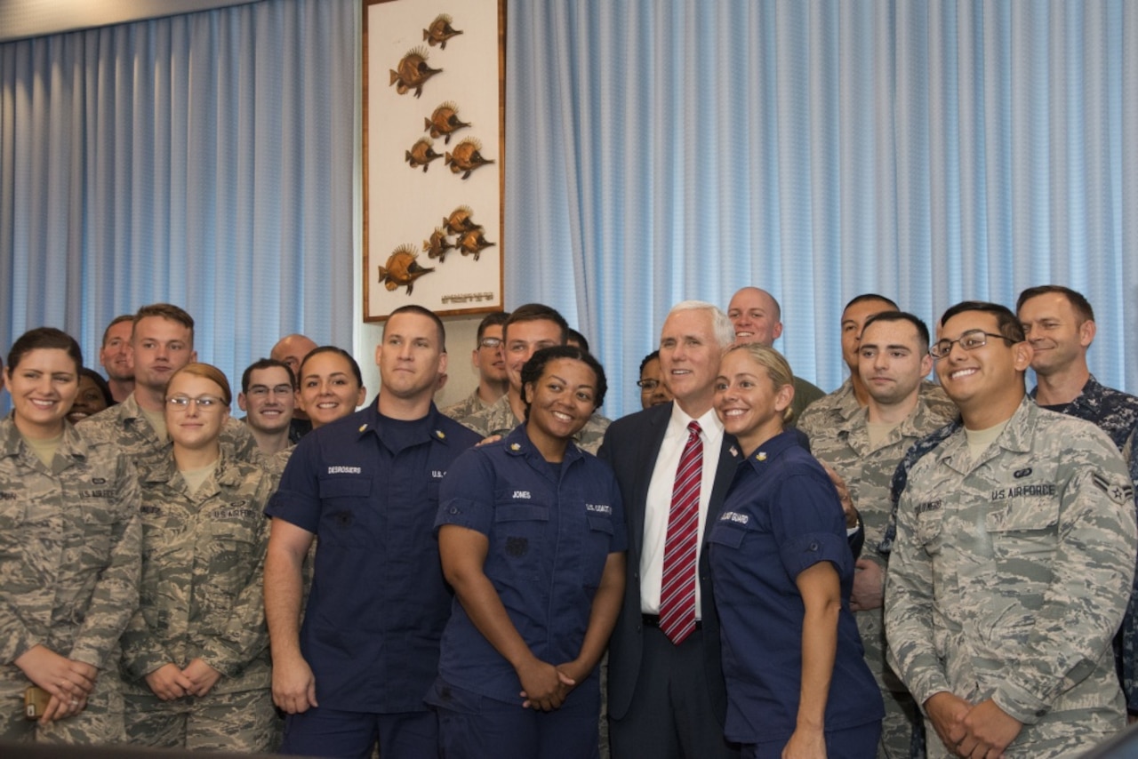 Vice President Mike Pence poses for a photo with U.S. service members stationed on the island of Oahu, Hawaii, April 24, 2017. Pence stopped in Hawaii to thank service members for "answering the call to serve our country," marking the end of a 10-day trip to Asia. Air Force photo by Master Sgt. Raquel Griffin