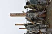 Soldiers of 1223rd Engineer Company, 778th Engineer Battalion, South Carolina Army National Guard, lay and level posts for the Multi-Purpose Covered Shelter at Cincu Training Area, Romania on 21 April 2017. The project is a part of Resolute Castle 17, an exercise which strengthens the NATO alliance and enhances its capacity to quickly respond to threats within the region. (US Army photo by Capt. Colin J. Cutler, 926th Engineer Brigade)