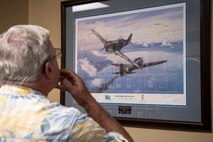 A veteran marvels at a photo on display during a tour of the 74th Fighter Squadron during a reunion, April 24 to 26, at Moody Air Force Base, Ga. The veterans were all stationed at Moody in the late 1970s. Many fought alongside one another during the Vietnam War in support of the F-4E Phantom II’s mission (U.S. Air Force Photo by Airman 1st Class Janiqua P. Robinson)