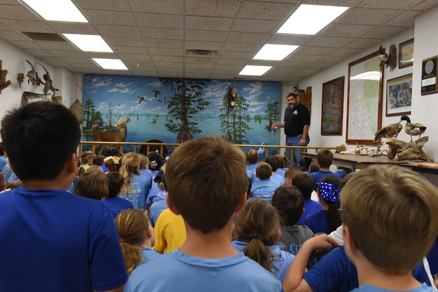 Natural resources personnel teach students about the local ecosystem and how to protect it during an Earth Day field trip at Barksdale Air Force Base, La., April 21, 2017. Children learned about different animals in the local ecosystem and the history behind Barksdale’s East Reservation. (U.S. Air Force photo/Senior Airman Luke Hill)