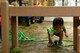 A Team Shaw child picks up a water hose at the 20th Force Support Squadron Child Development Center at Shaw Air Force Base, S.C., April 21, 2017. Children participated in Earth Day activities which demonstrated caring for natural outdoor spaces. (U.S. Air Force photo by Airman 1st Class Kathryn R.C. Reaves)
